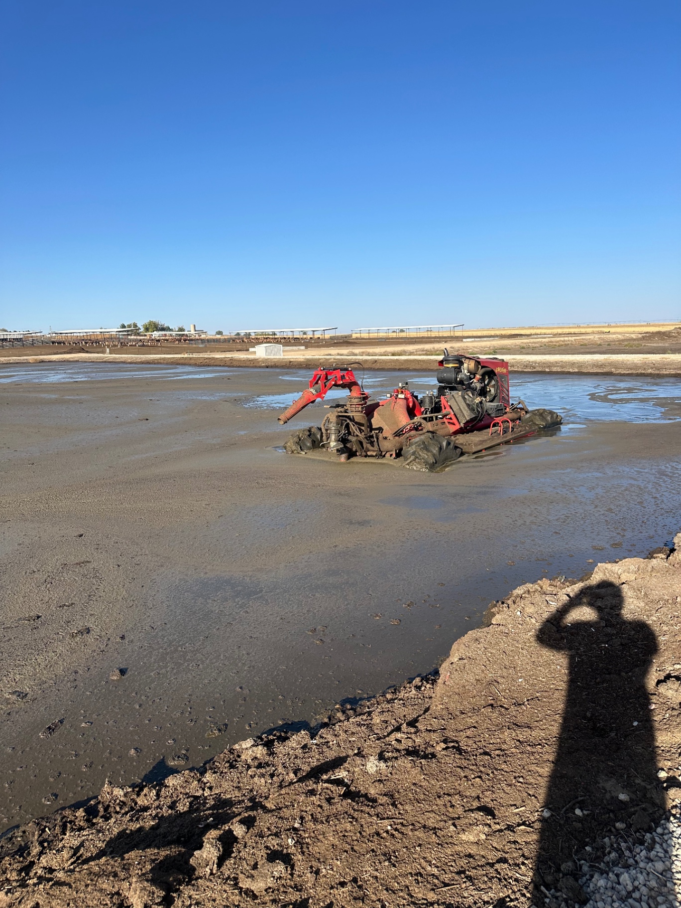 Nuhn lagoon crawler agitating a manure lagoon